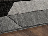Floridian Furniture - Ashley Furniture - Chayse Rug - 5' x 6'7" Rug / Black/Gray - R403462