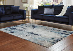Floridian Furniture - Ashley Furniture - Leonelle Rug - 7'10" x 10' Rug / White/Blue/Gray - R404871