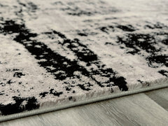 Floridian Furniture - Ashley Furniture - Zekeman Rug - 5'3" x 7'7" Rug / Black/Cream/Gray - R404922