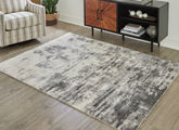 Floridian Furniture - Ashley Furniture - Gerdie Rug - 7'10" x 10' Rug / Cream/Gray - R404991