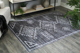 Floridian Furniture - Ashley Furniture - Arloman Rug - 5' x 7' Washable Rug / Black/Cream/Gray - R405932
