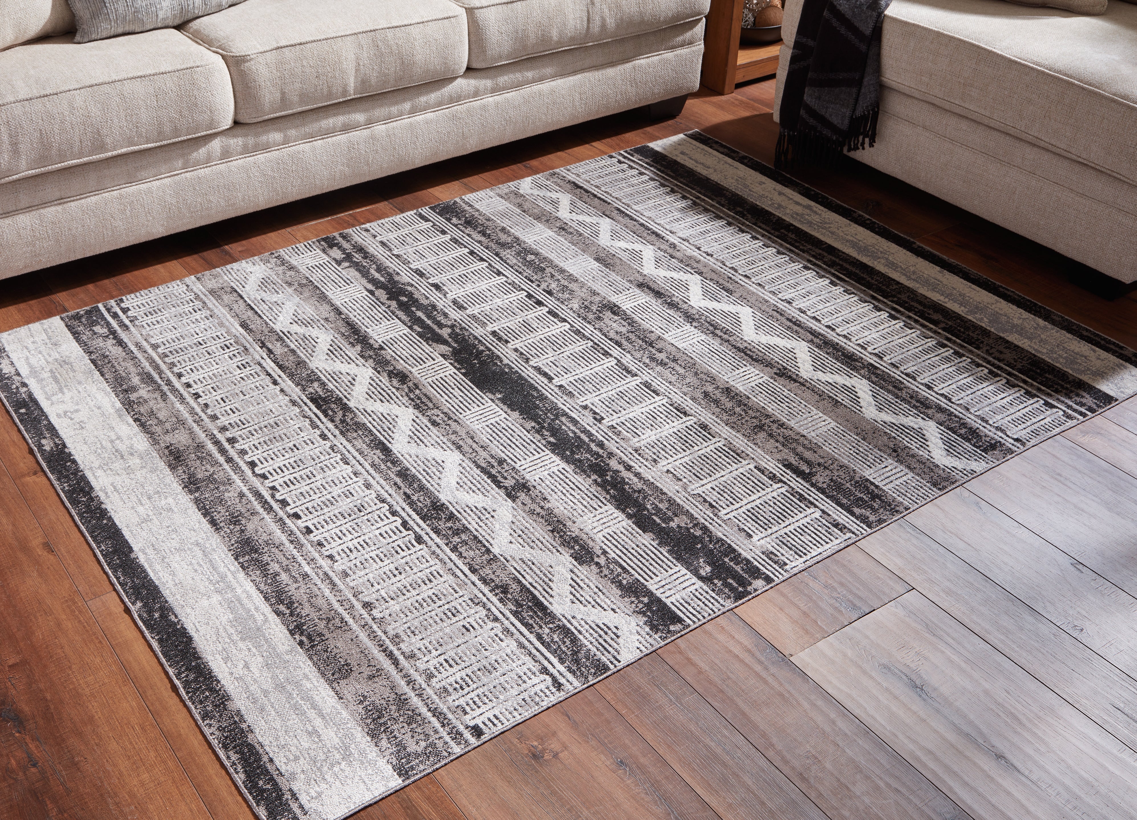 Floridian Furniture - Ashley Furniture - Henchester Rug - 5' x 7' Washable Rug / Multi - R405992