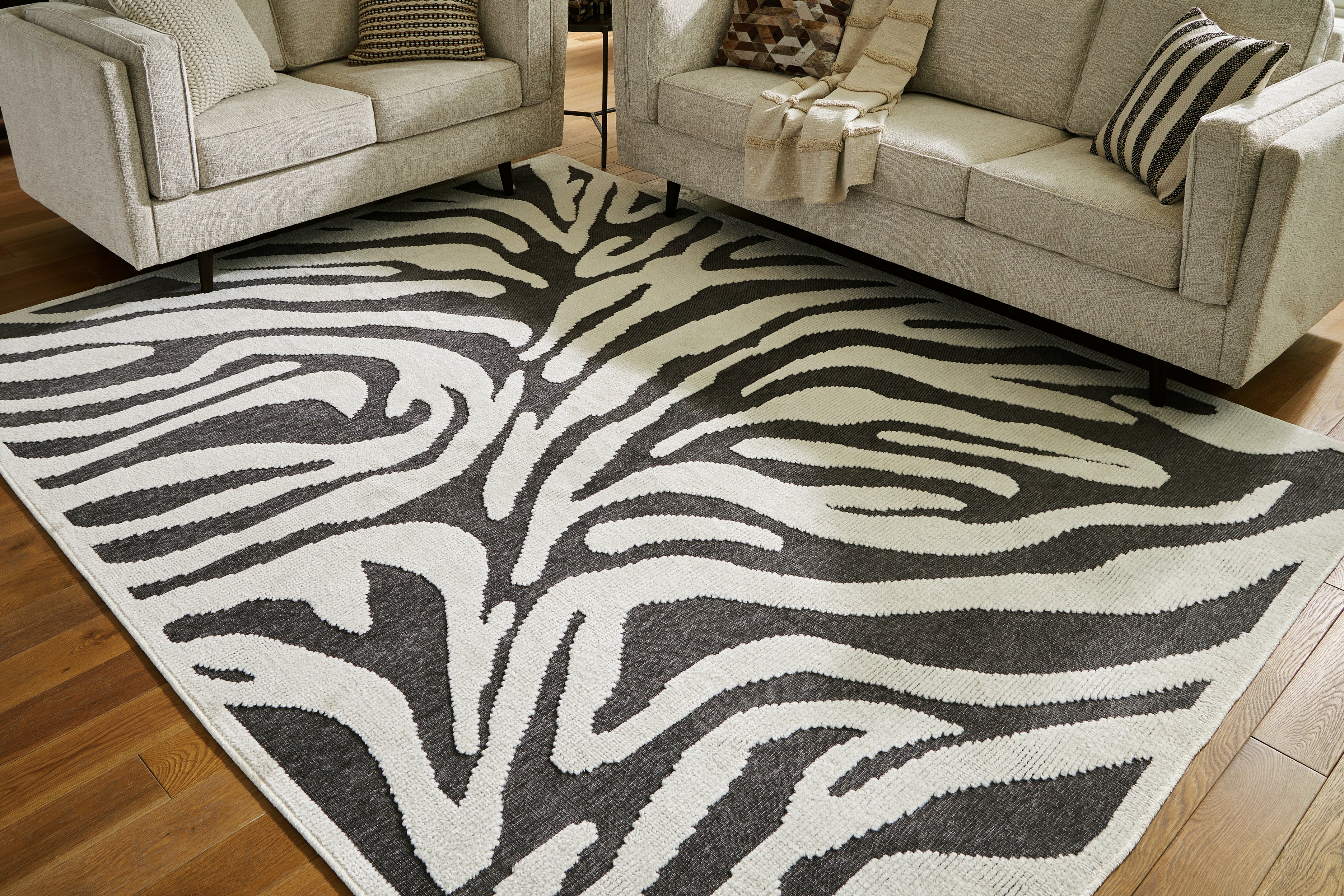 Floridian Furniture - Ashley Furniture - Thomwith Rug - 8' x 10'2" Washable Rug / Black/Ivory - R406291