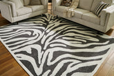 Floridian Furniture - Ashley Furniture - Thomwith Rug - 8' x 10'2" Washable Rug / Black/Ivory - R406291