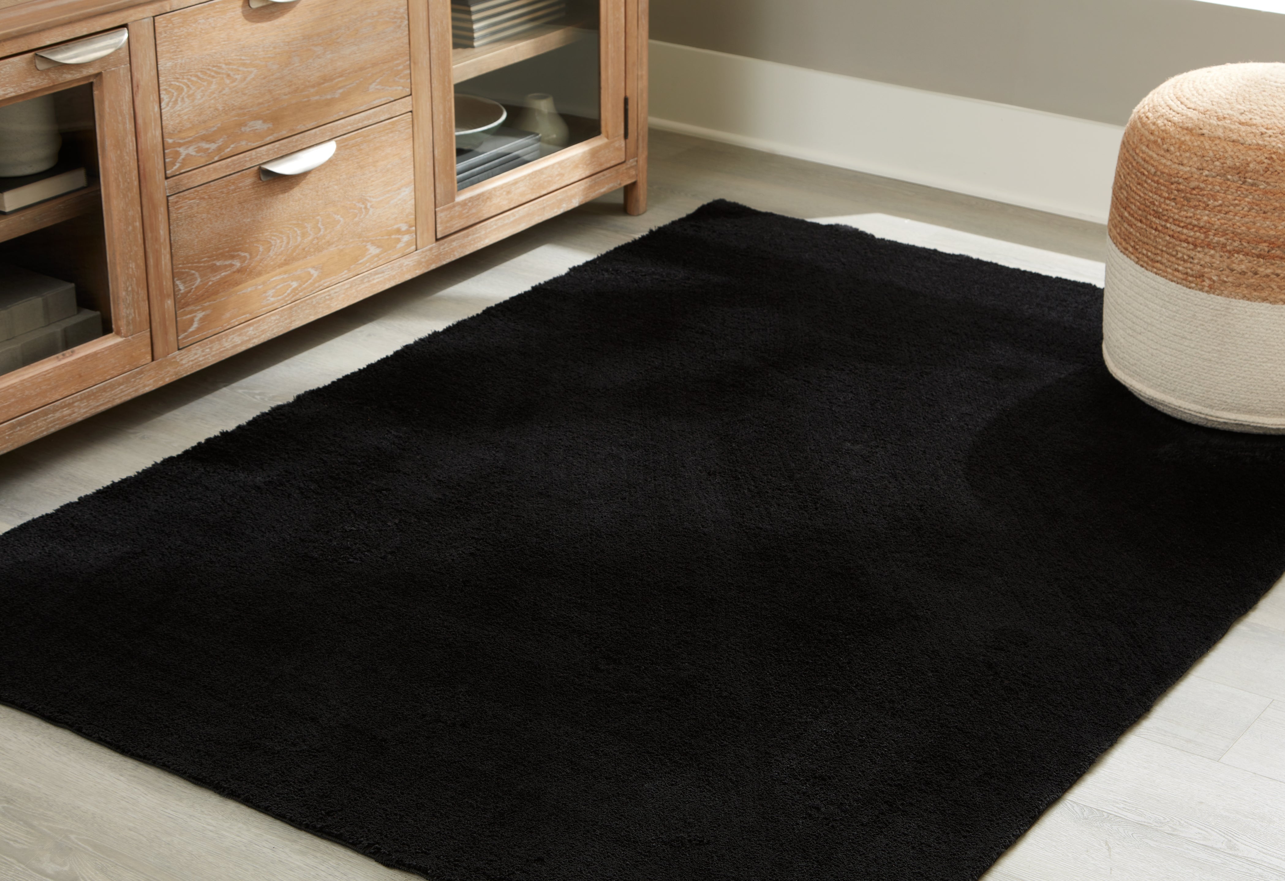 Floridian Furniture - Ashley Furniture - Anaben Rug - 8' x 10'1" Washable Rug / Black - R406311