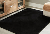 Floridian Furniture - Ashley Furniture - Anaben Rug - 8' x 10'1" Washable Rug / Black - R406311