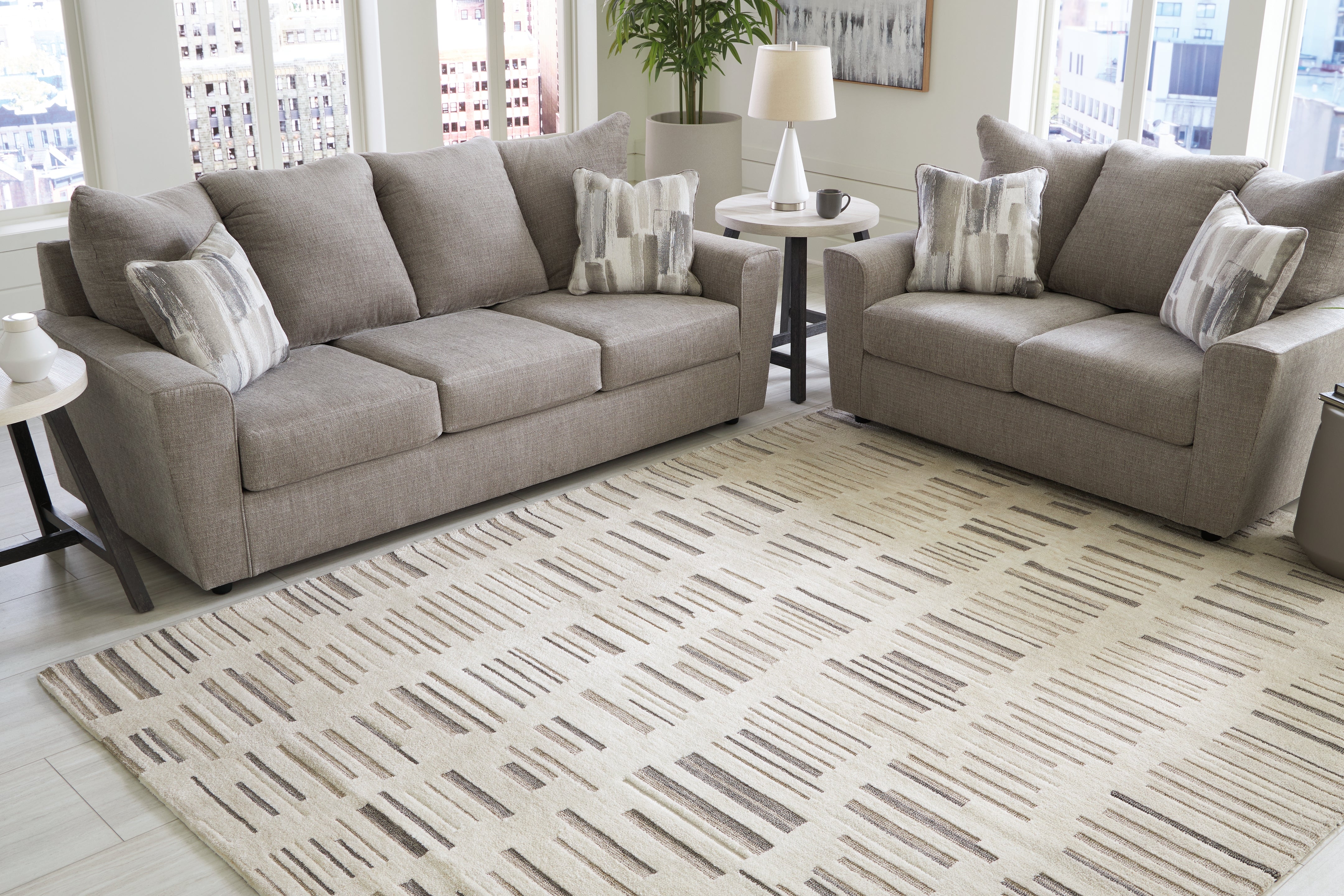 Floridian Furniture - Ashley Furniture - Leesdale Rug - 5' x 7' Rug / Ivory/Brown/Black - R406422