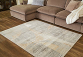 Floridian Furniture - Ashley Furniture - Truward Rug - 5' x 7' Rug / Linen/Gray/Caramel - R406472