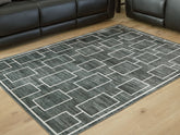 Floridian Furniture - Ashley Furniture - Elderland Rug - Washable 5' x 7' Area Rug / Black/Gray - R407402