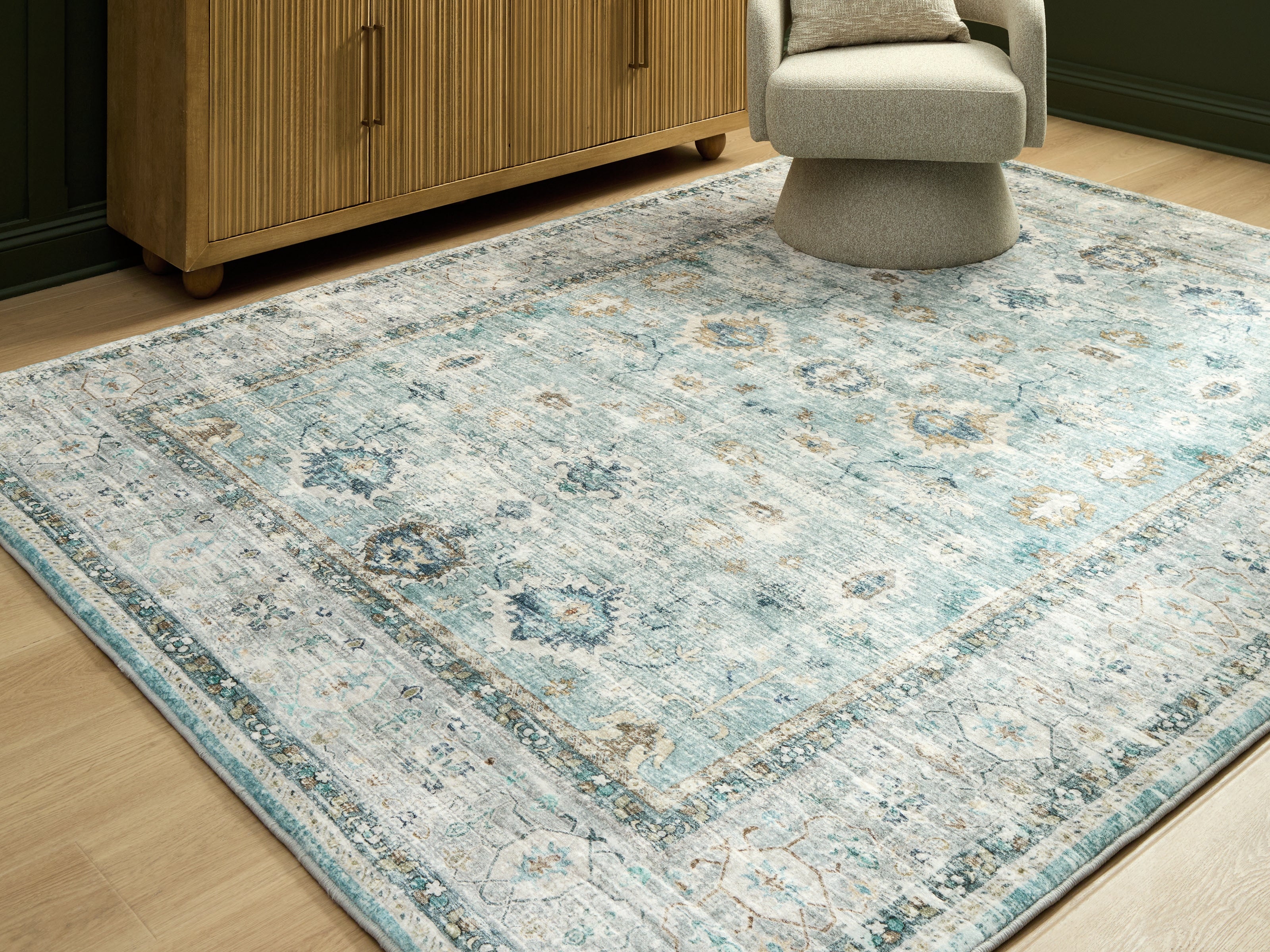 Floridian Furniture - Ashley Furniture - Ladstoney Rug - 7'6" x 9'6" Area Rug / Teal/Beige/Ochre - R407501