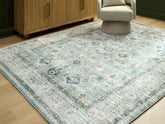 Floridian Furniture - Ashley Furniture - Ladstoney Rug - 7'6" x 9'6" Area Rug / Teal/Beige/Ochre - R407501