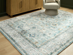 Floridian Furniture - Ashley Furniture - Ladstoney Rug - 7'6" x 9'6" Area Rug / Teal/Beige/Ochre - R407501