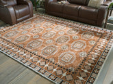 Floridian Furniture - Ashley Furniture - Qaabiz Rug - 7'8" x 10' Area Rug / Sienna/Ivory/Black - R407521