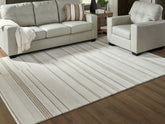 Floridian Furniture - Ashley Furniture - Gadence Rug - 7'8" x 10' Area Rug / Ivory/Tan - R407641