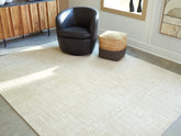 Floridian Furniture - Ashley Furniture - Wolbert Rug - 7'8" x 10' Area Rug / Tan/Ivory - R407661