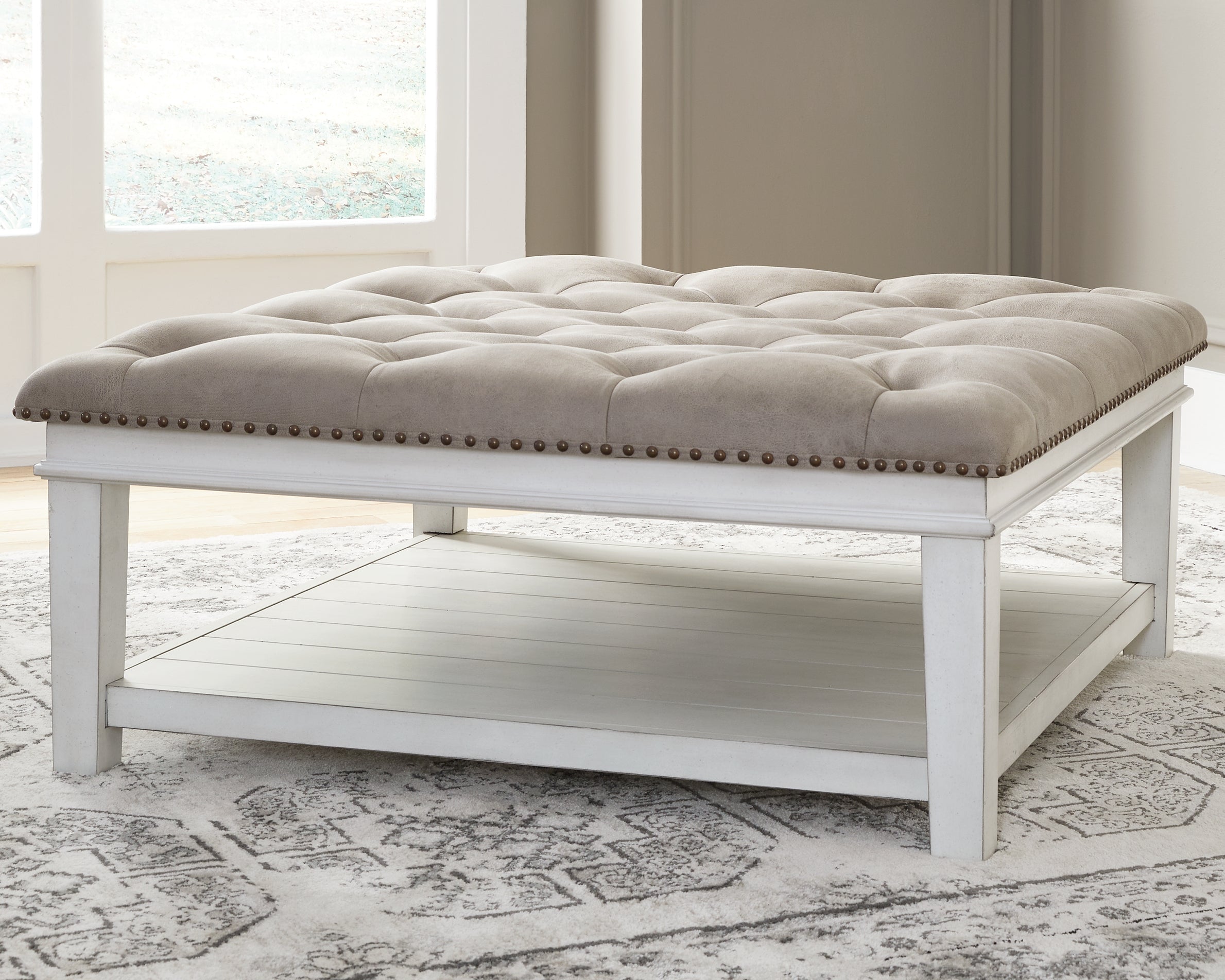 Floridian Furniture - Ashley Furniture - Kanwyn Upholstered Ottoman Coffee Table - UPH Ottoman Cocktail Table / Whitewash - T937-21