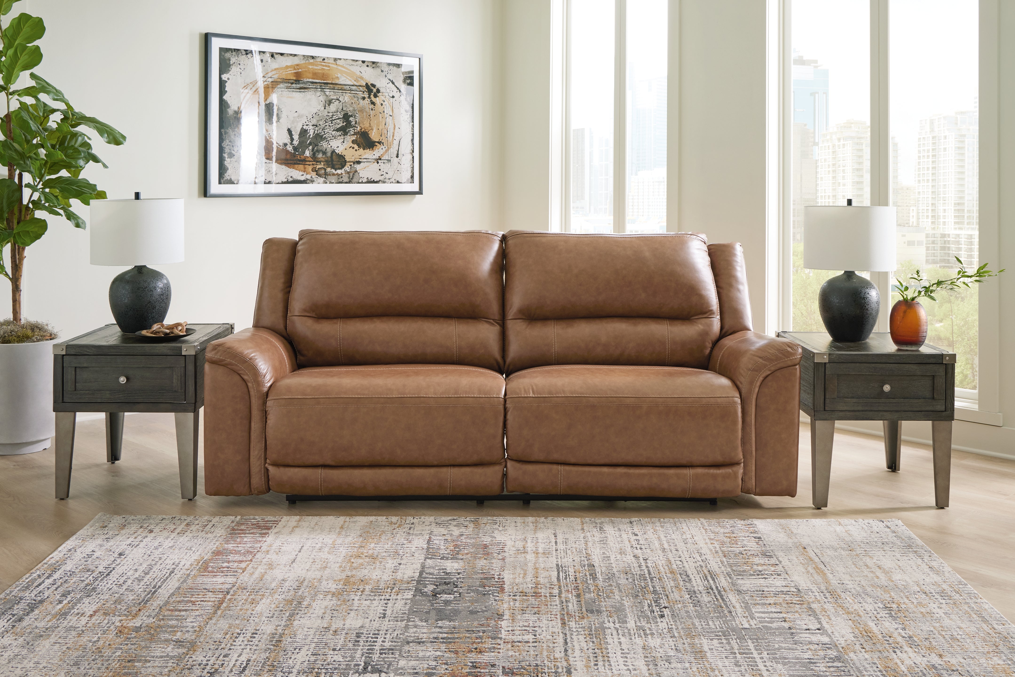 Floridian Furniture - Ashley Furniture - Trasimeno Living Room - PWR Recliner/ADJ Headrest / Caramel - U8281513