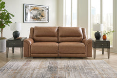 Floridian Furniture - Ashley Furniture - Trasimeno Living Room - PWR Recliner/ADJ Headrest / Caramel - U8281513
