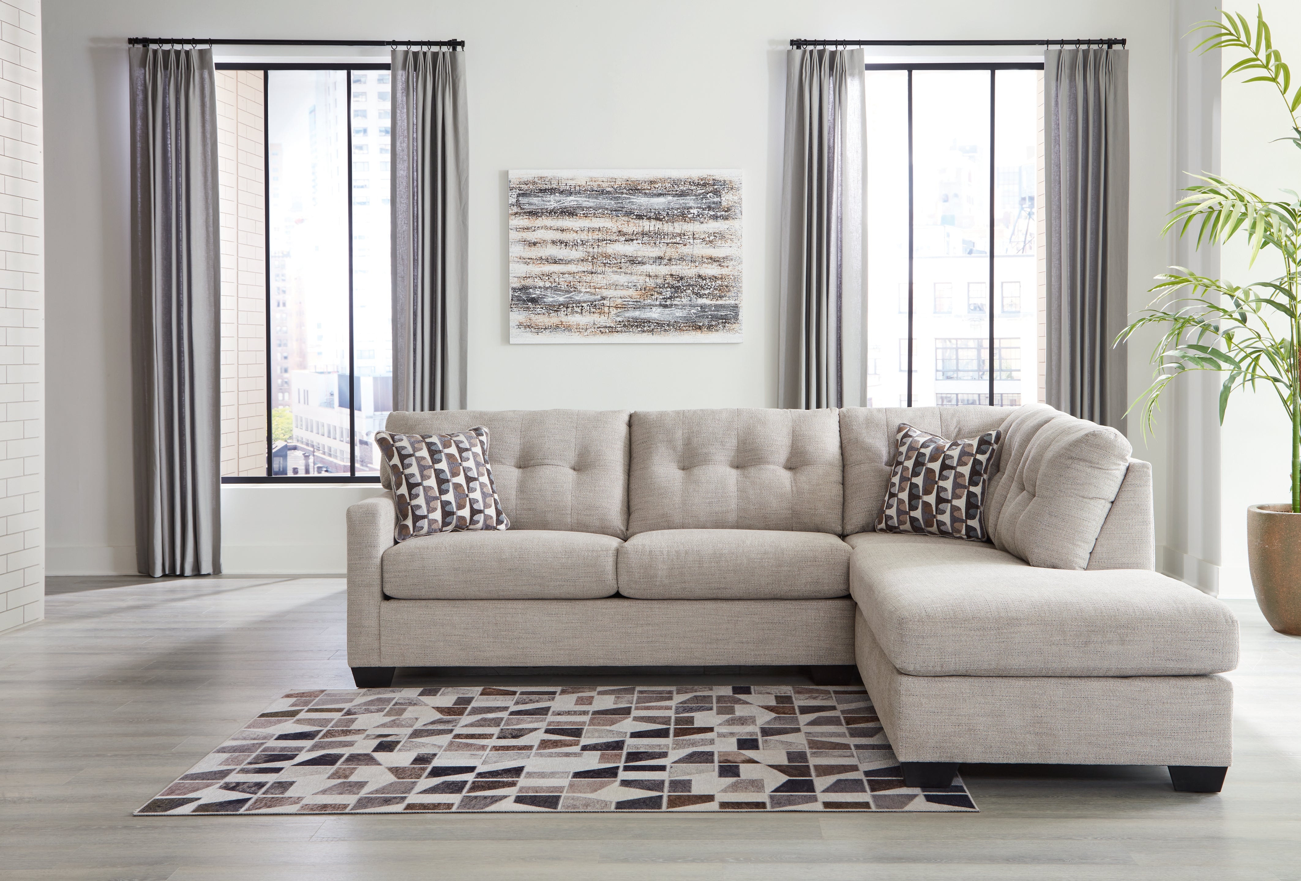 Floridian Furniture - Ashley Furniture - Mahoney Sectional - LAF 2-Piece Sectional with Chaise / Pebble - 31004S2