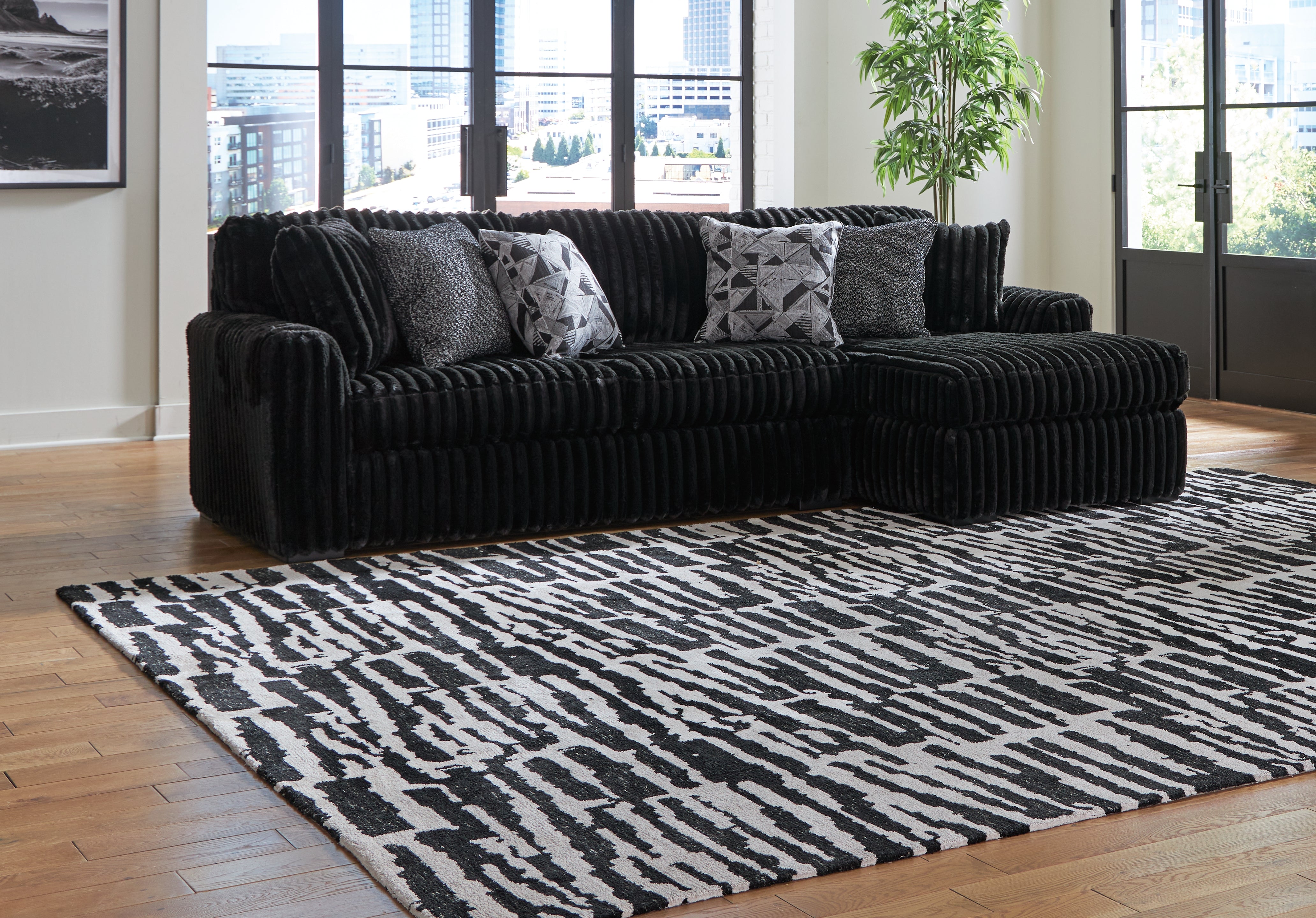 Floridian Furniture - Ashley Furniture - Midnight-Madness Sectional - LAF 2-Piece Sectional Sofa with Chaise / Onyx - 98103S2