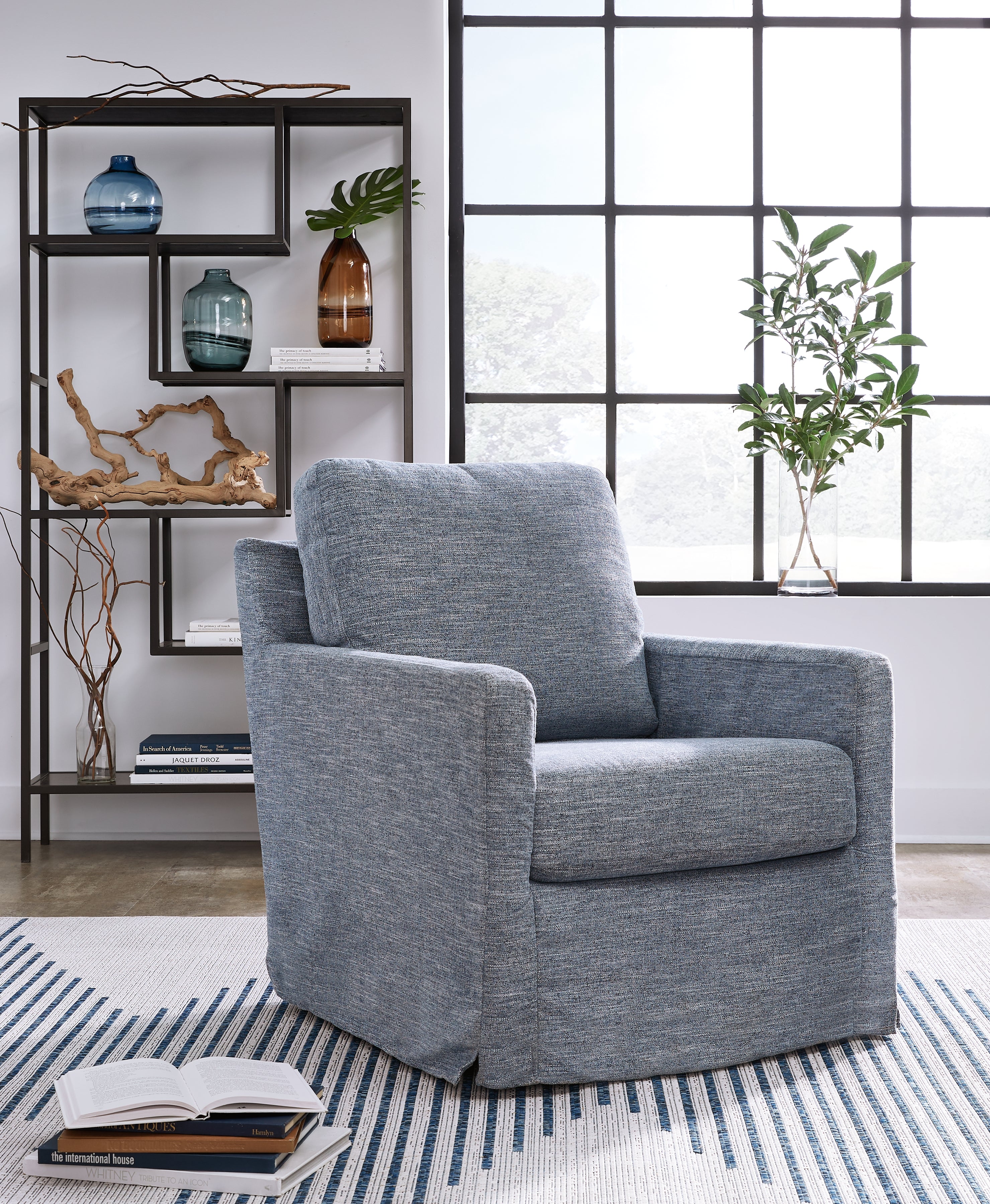 Floridian Furniture - Ashley Furniture - Nenana Next-Gen Nuvella Swivel Glider Accent Chair - Swivel Glider Accent Chair / Denim - A3000646