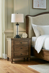 Floridian Furniture - Ashley Furniture - Sturlayne Bedroom - California King Upholstered Panel Bed / Brown - B787B5