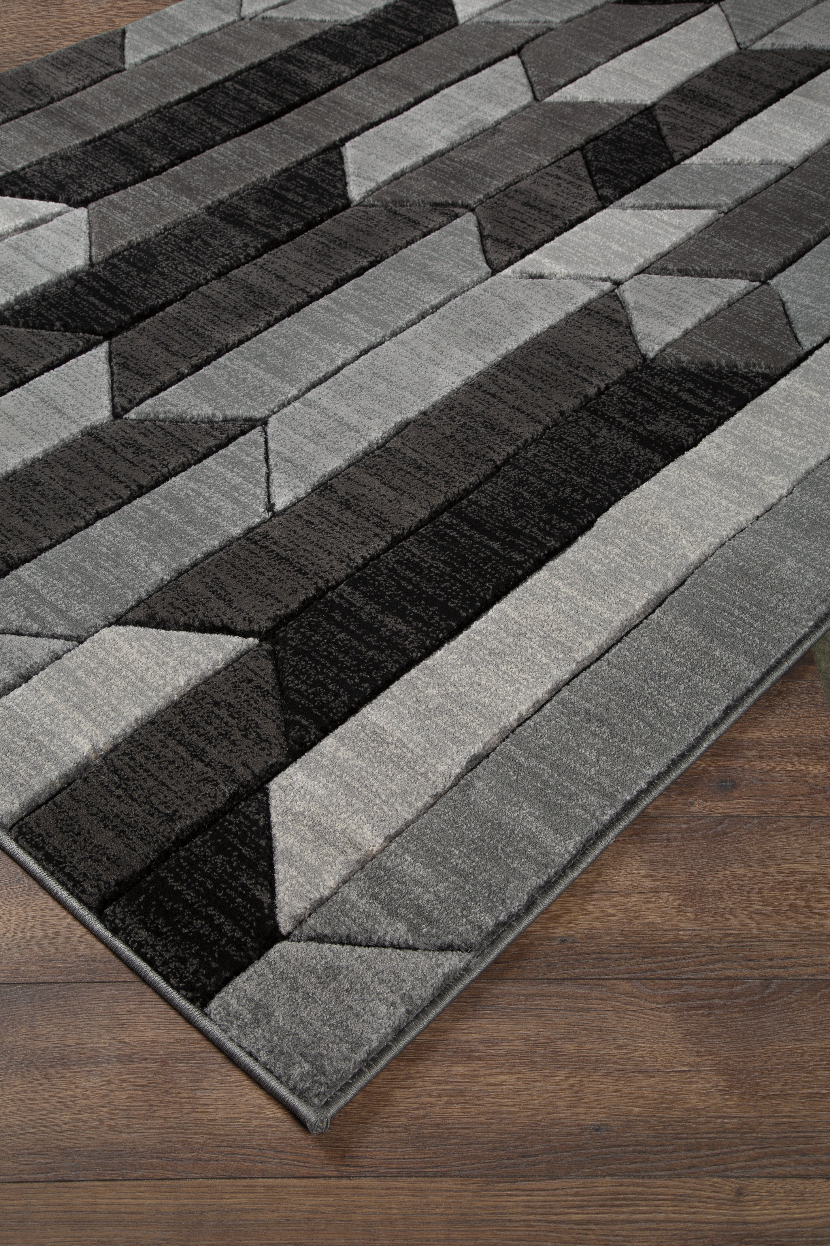 Floridian Furniture - Ashley Furniture - Chayse Rug - 6'6" x 9'6" Rug / Black/Gray - R403461
