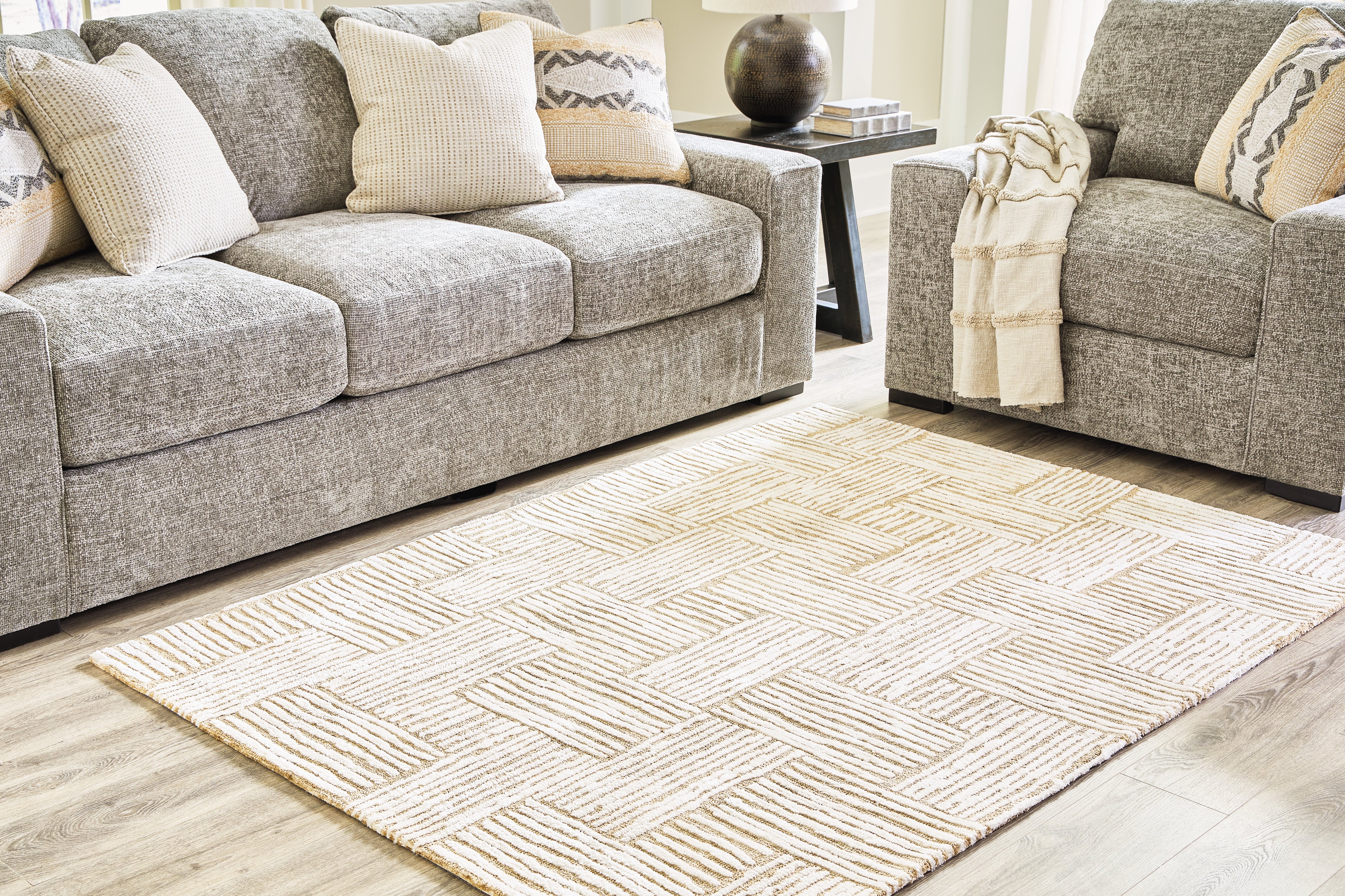 Floridian Furniture - Ashley Furniture - Adanmund Rug - 5' x 7' Rug / Beige/Caramel - R406412