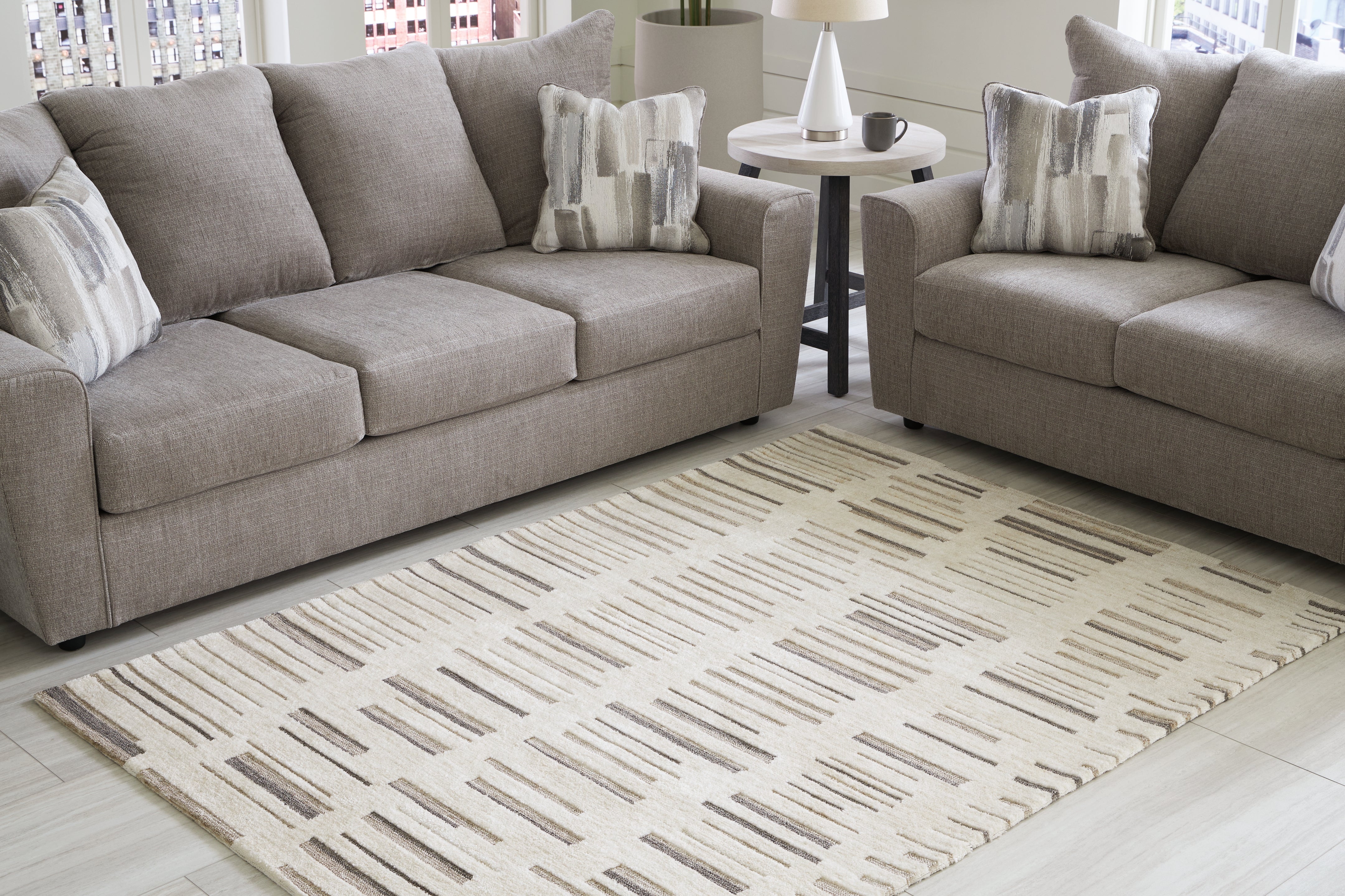 Floridian Furniture - Ashley Furniture - Leesdale Rug - 5' x 7' Rug / Ivory/Brown/Black - R406422