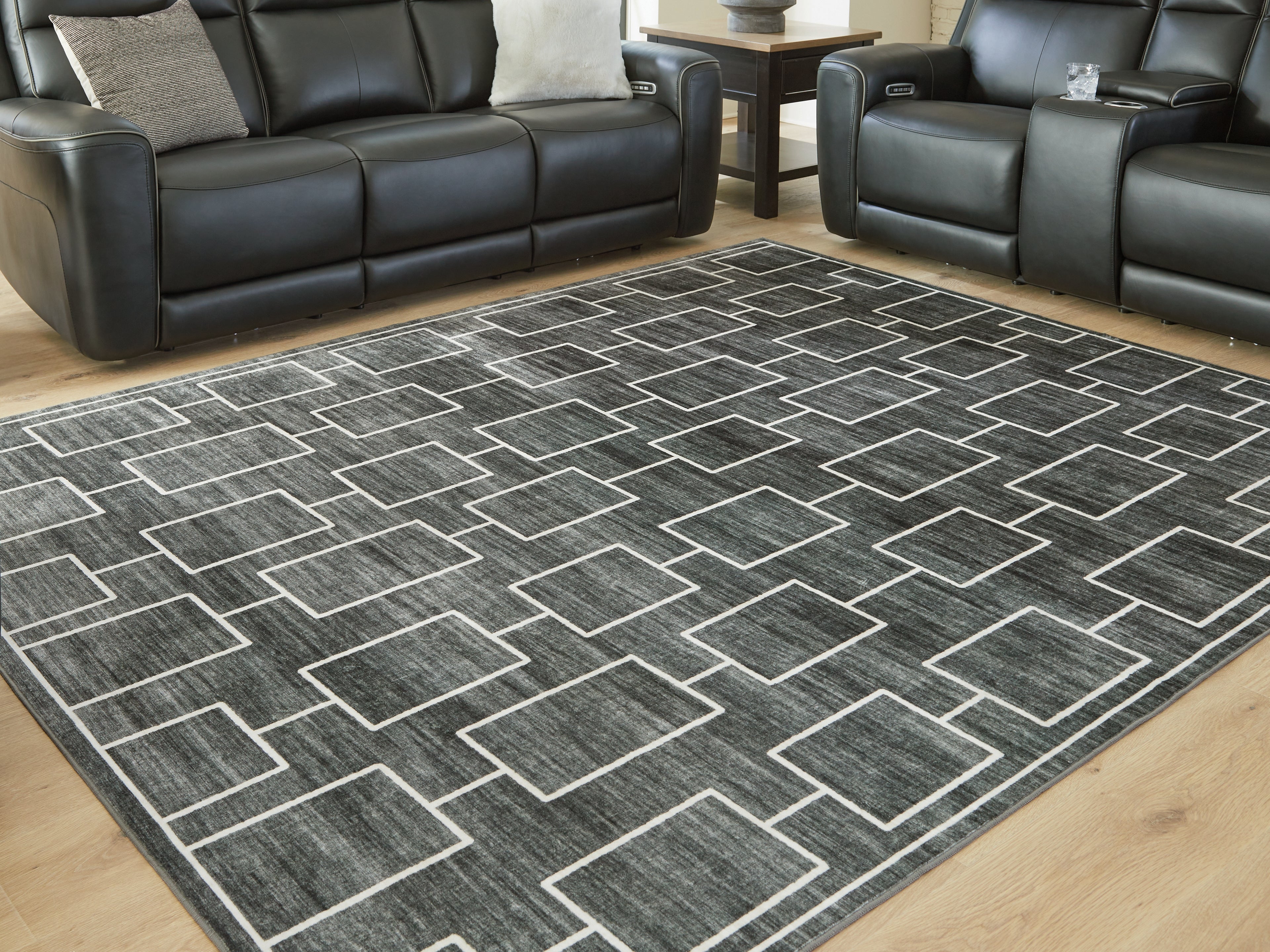 Floridian Furniture - Ashley Furniture - Elderland Rug - Washable 7'6" x 9'6" Area Rug / Black/Gray - R407401
