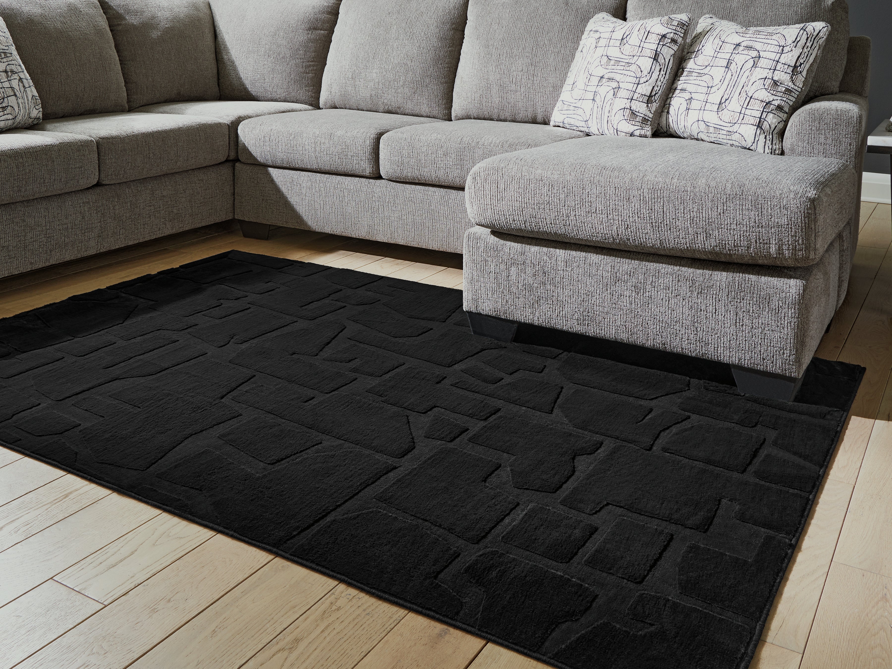 Floridian Furniture - Ashley Furniture - Gibbswell Rug - Washable 5' x 7' Area Rug / Black - R407462