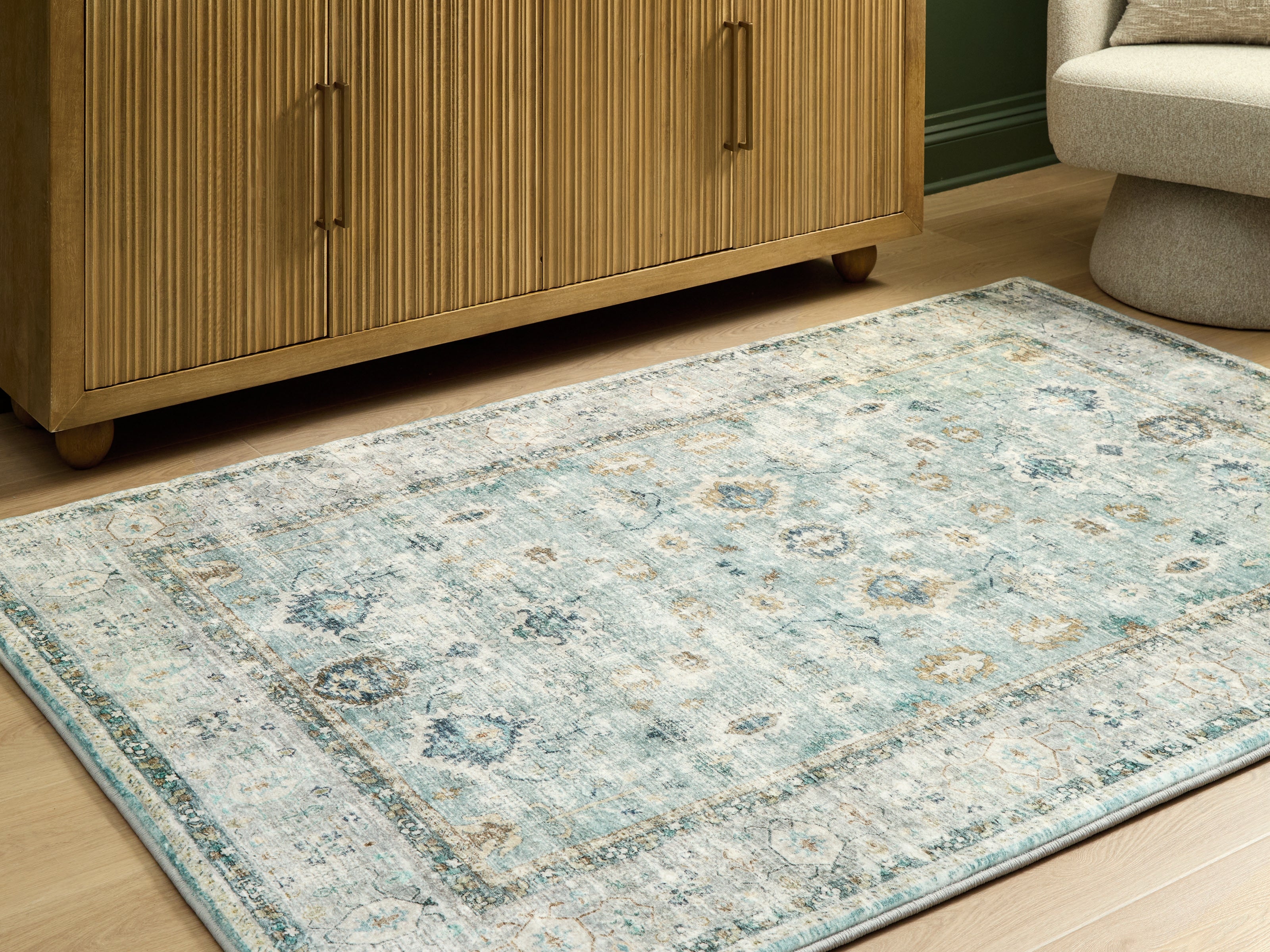 Floridian Furniture - Ashley Furniture - Ladstoney Rug - 5' x 7' Area Rug / Teal/Beige/Ochre - R407502