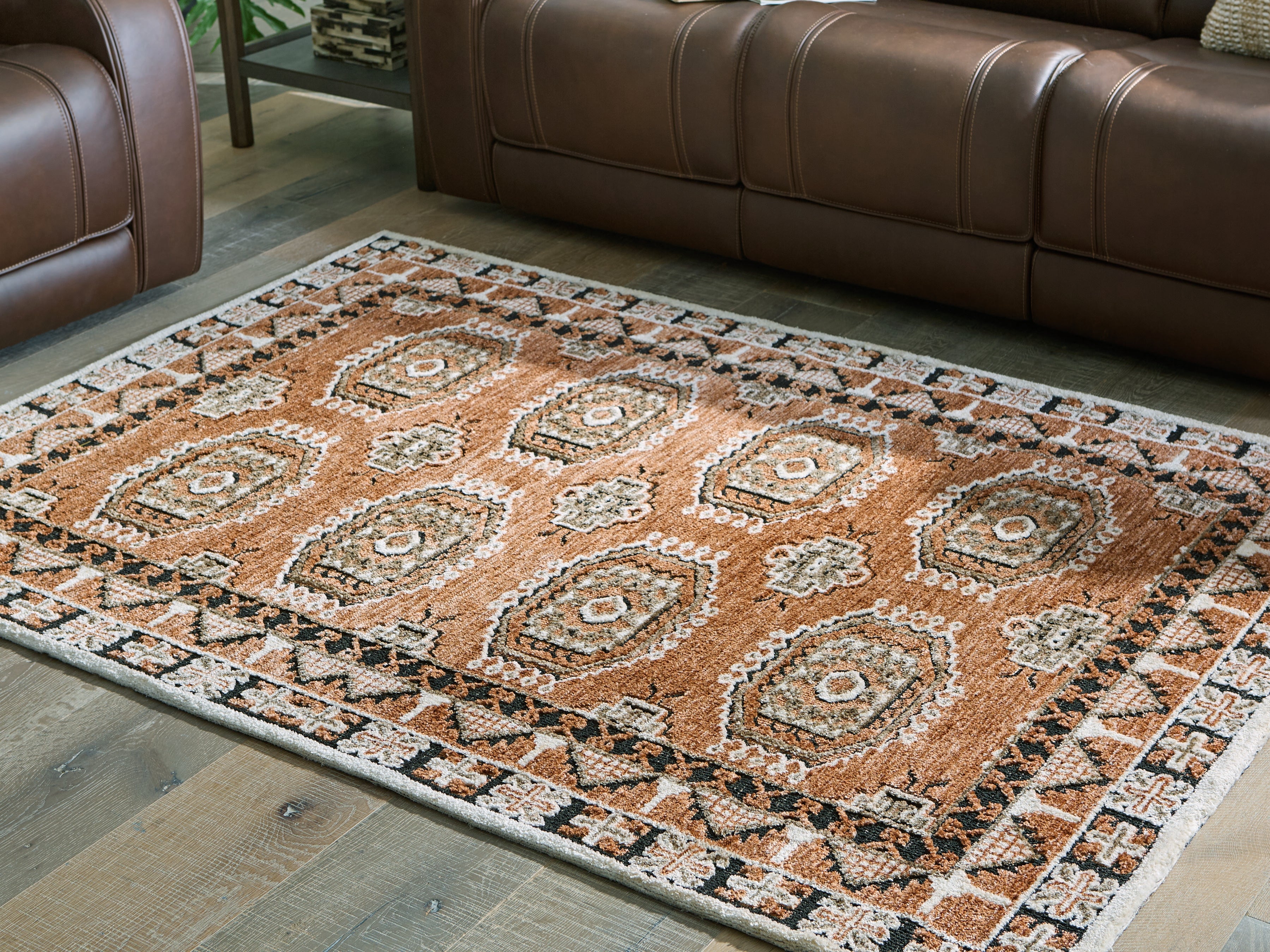 Floridian Furniture - Ashley Furniture - Qaabiz Rug - 5' x 7' Area Rug / Sienna/Ivory/Black - R407522