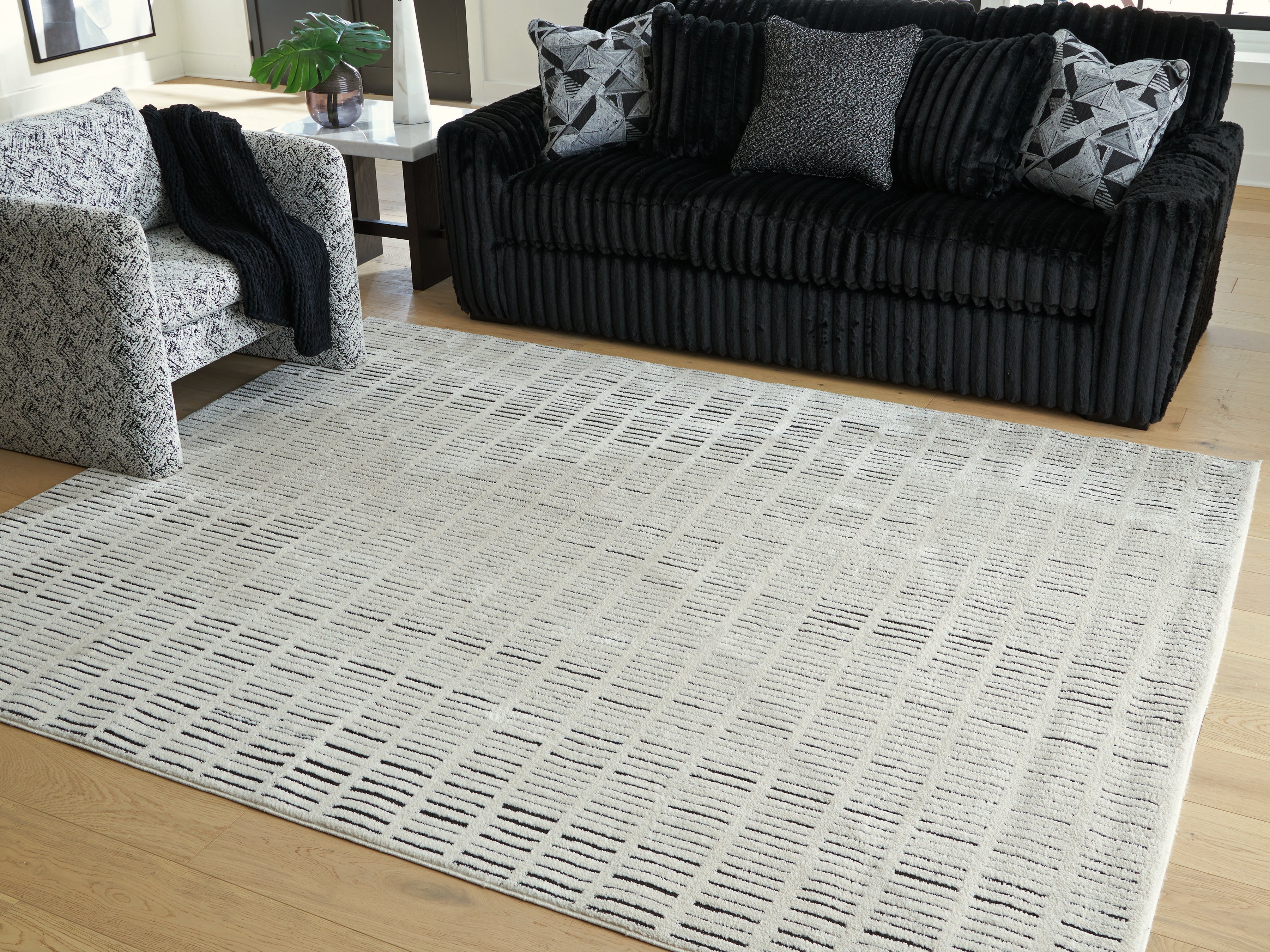 Floridian Furniture - Ashley Furniture - Turinwith Rug - 7'10" x 9'10" Area Rug / Ivory/Black - R407551