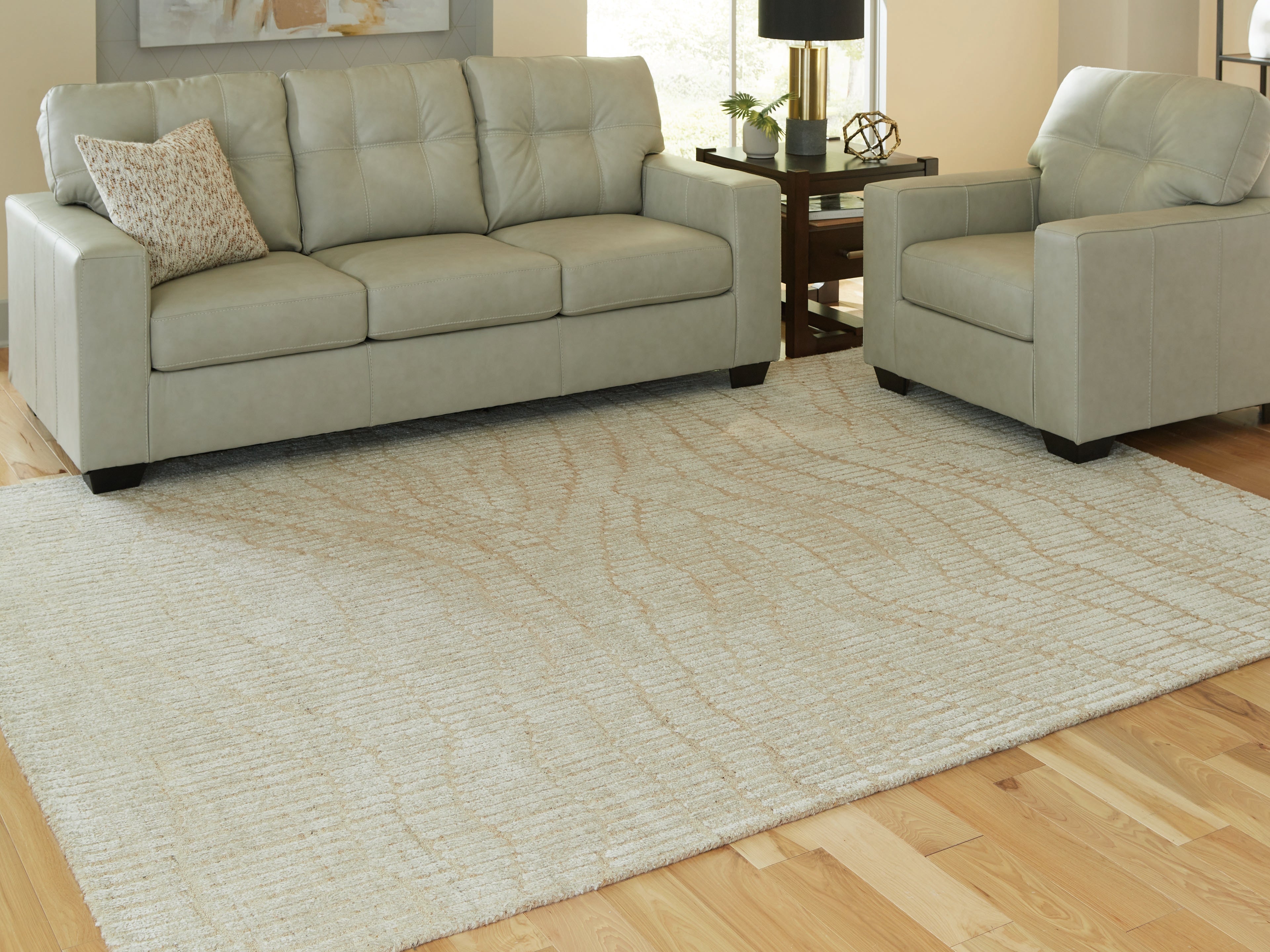 Floridian Furniture - Ashley Furniture - Jaseena Rug - 7'8" x 10' Area Rug / Beige/Tan - R407721