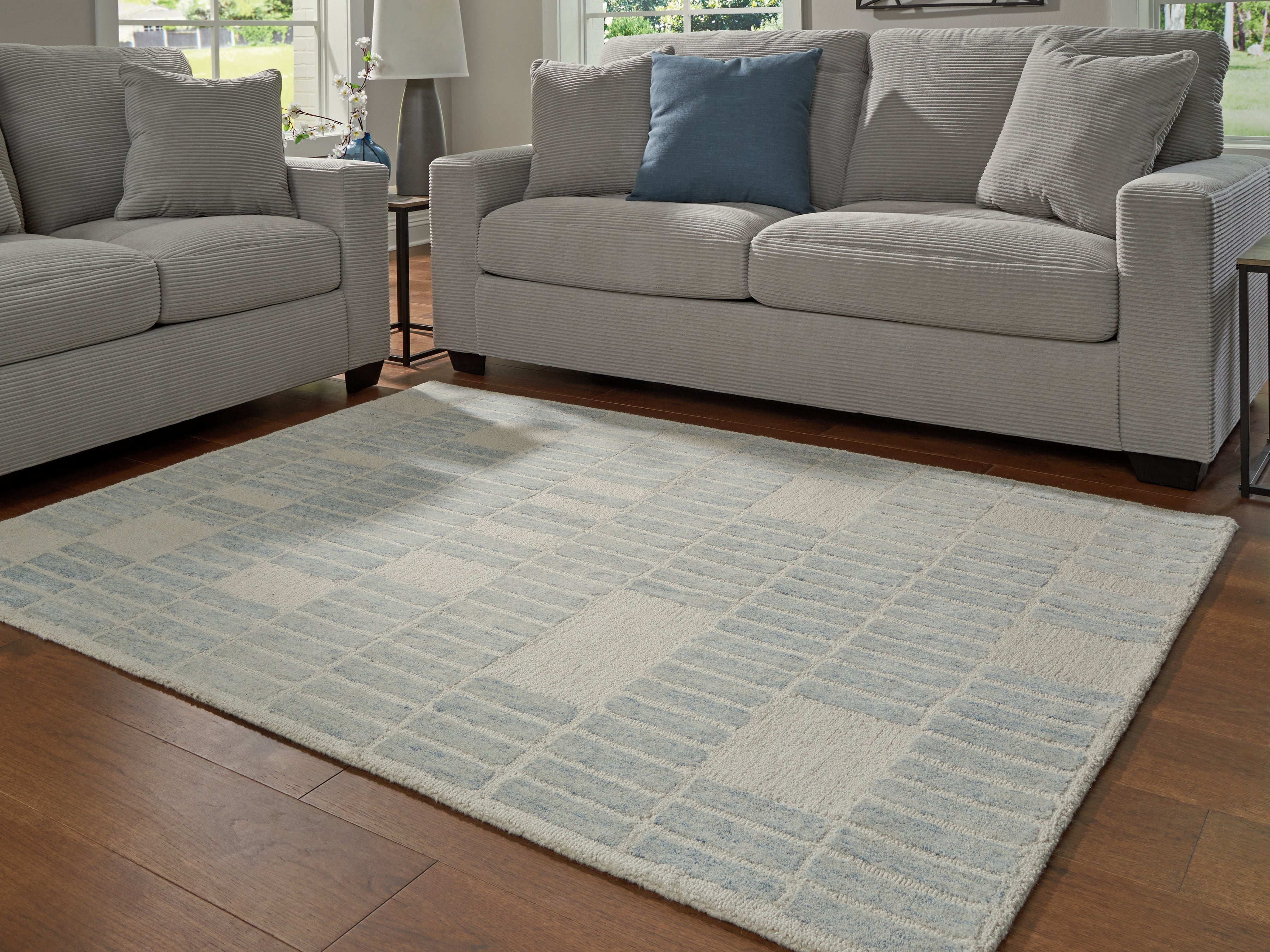 Floridian Furniture - Ashley Furniture - Dylanton Rug - 5' x 7' Area Rug / Ivory/Blue - R407812