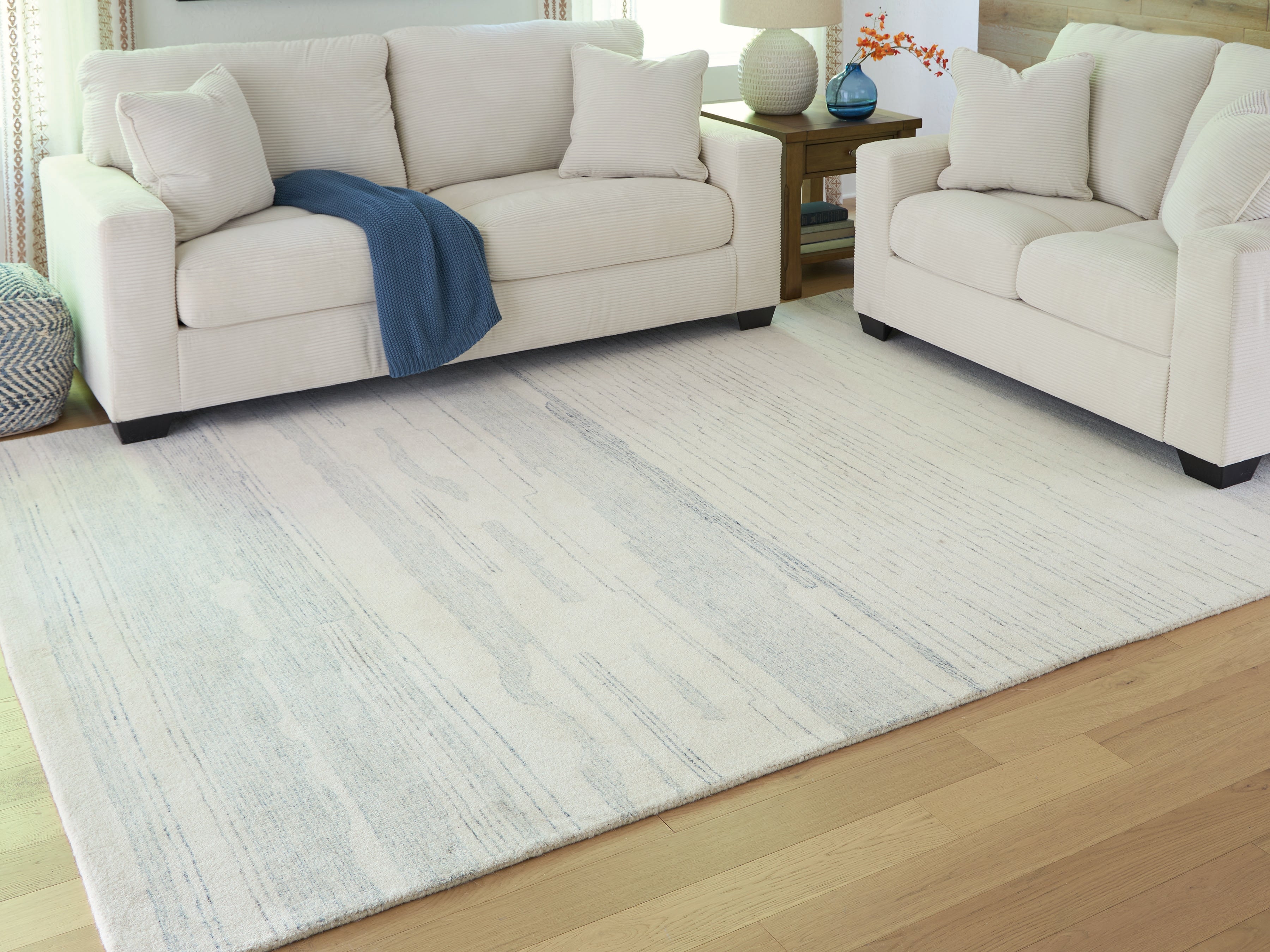 Floridian Furniture - Ashley Furniture - Genemost Rug - 7'8" x 10' Area Rug / Ivory/Blue - R407841