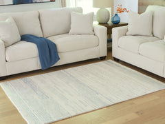 Floridian Furniture - Ashley Furniture - Genemost Rug - 5' x 7' Area Rug / Ivory/Blue - R407842